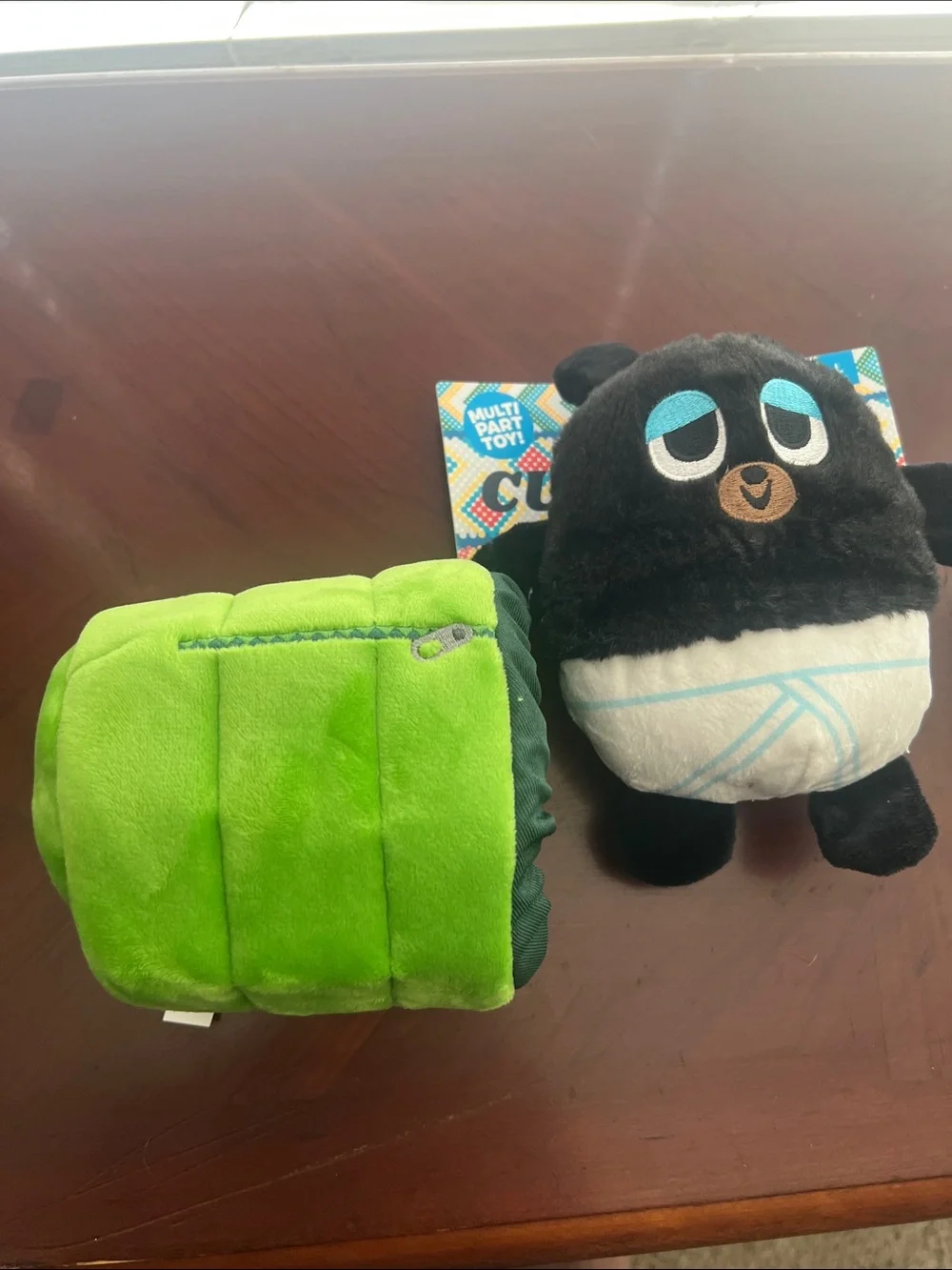 Plush Black Bear in Green Sleeping Bag Dog Toy